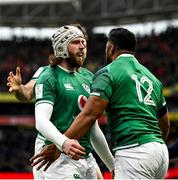 5 February 2022; Bundee Aki of Ireland celebrates with teammate Mack Hansen after scoring his side's first try during the Guinness Six Nations Rugby Championship match between Ireland and Wales at the Aviva Stadium in Dublin. Photo by Harry Murphy/Sportsfile