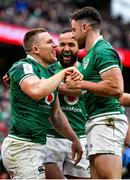 5 February 2022; Andrew Conway of Ireland, left, celebrates with teammates Jamison Gibson Park, centre, and Hugo Keenan after scoring their side's second try during the Guinness Six Nations Rugby Championship match between Ireland and Wales at the Aviva Stadium in Dublin. Photo by Brendan Moran/Sportsfile