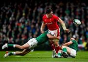 5 February 2022; Taine Basham of Wales offloads as he is tackled by Hugo Keenan, left, and Garry Ringrose of Ireland during the Guinness Six Nations Rugby Championship match between Ireland and Wales at the Aviva Stadium in Dublin. Photo by Harry Murphy/Sportsfile