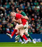 5 February 2022; Josh Adams of Wales tackles Jonathan Sexton of Ireland, resulting in a yellow card, during the Guinness Six Nations Rugby Championship match between Ireland and Wales at the Aviva Stadium in Dublin. Photo by Harry Murphy/Sportsfile