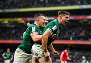 5 February 2022; Garry Ringrose of Ireland, right, is congratulated by teammates Andrew Conway, left, and Jonathan Sexton after scoring his side's fourth try during the Guinness Six Nations Rugby Championship match between Ireland and Wales at the Aviva Stadium in Dublin. Photo by Brendan Moran/Sportsfile