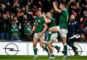 5 February 2022; Garry Ringrose of Ireland, left, celebrates with teammates including, Jonathan Sexton, right, and Andrew Conway, centre, after scoring their side's fourth try during the Guinness Six Nations Rugby Championship match between Ireland and Wales at the Aviva Stadium in Dublin. Photo by Brendan Moran/Sportsfile