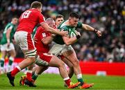 5 February 2022; Dan Sheehan of Ireland is tackled by Dillon Lewis, and Seb Davies, left, of Wales during the Guinness Six Nations Rugby Championship match between Ireland and Wales at the Aviva Stadium in Dublin. Photo by Brendan Moran/Sportsfile