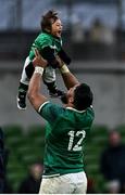 5 February 2022; Bundee Aki of Ireland lifts his one year old son Andronicus Junior Papamau after the Guinness Six Nations Rugby Championship match between Ireland and Wales at the Aviva Stadium in Dublin. Photo by Brendan Moran/Sportsfile