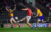 5 February 2022; Colm O'Callaghan of Cork scores a point despite the efforts of Jamie Malone, left, and David Tubridy of Clare during the Allianz Football League Division 2 match between Cork and Clare at Páirc Ui Chaoimh in Cork. Photo by Ben McShane/Sportsfile
