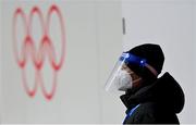 6 February 2022: A member of security, wearing a face covering, before the Men's Downhill Skiing event on day two of the Beijing 2022 Winter Olympic Games at National Alpine Skiing Centre in Yanqing, China. Photo by Ramsey Cardy/Sportsfile