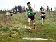 6 February 2022; Stephen Ruane of Calasanctius College Oranmore leaps over a puddle during the minor boys race at the Irish Life Health Connacht Schools Cross Country at Bushfield in Loughrea, Galway. Photo by Ben McShane/Sportsfile