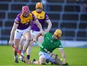 6 February 2022; Tom Morrissey of Limerick is tackled by Paudie Foley, 6, and Simon Donohoe of Wexford during the Allianz Hurling League Division 1 Group A match between Wexford and Limerick at Chadwicks Wexford Park in Wexford. Photo by Ray McManus/Sportsfile