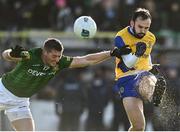 6 February 2022; Donie Smith of Roscommon kicks a point under pressure from Gavin McGowan of Meath during the Allianz Football League Division 2 match between Meath and Roscommon at Páirc Táilteann in Navan, Meath. Photo by Harry Murphy/Sportsfile
