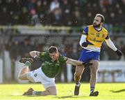 6 February 2022; Donie Smith of Roscommon watches his shot at goal under pressure from Gavin McGowan of Meath during the Allianz Football League Division 2 match between Meath and Roscommon at Páirc Táilteann in Navan, Meath. Photo by Harry Murphy/Sportsfile