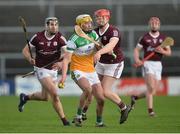 6 February 2022; Ross Ravenhill of Offaly in action against Tom Monaghan and Jack Hastings of Galway during the Allianz Hurling League Division 1 Group A match between Galway and Offaly at Pearse Stadium in Galway. Photo by Ray Ryan/Sportsfile