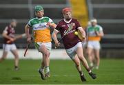 6 February 2022; Tom Monaghan of Galway in action against Eoghan Cahill of Offaly during the Allianz Hurling League Division 1 Group A match between Galway and Offaly at Pearse Stadium in Galway. Photo by Ray Ryan/Sportsfile