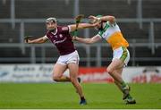 6 February 2022; Jack Hastings of Galway in action against Ben Conneely of Offaly during the Allianz Hurling League Division 1 Group A match between Galway and Offaly at Pearse Stadium in Galway. Photo by Ray Ryan/Sportsfile