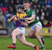 6 February 2022; Mikie Dwyer of Wexford is tackled by Simon Barry Nash of Limerick on his way to scoring a goal, in the 23rd minute of the second half, during the Allianz Hurling League Division 1 Group A match between Wexford and Limerick at Chadwicks Wexford Park in Wexford. Photo by Ray McManus/Sportsfile