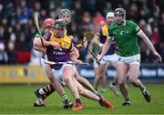 6 February 2022; Mikie Dwyer of Wexford is tackled by Simon Barry Nash of Limerick on his way to scoring a goal, in the 23rd minute of the second half, during the Allianz Hurling League Division 1 Group A match between Wexford and Limerick at Chadwicks Wexford Park in Wexford. Photo by Ray McManus/Sportsfile
