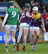 6 February 2022; William O’Donoghue of Limerick looks on as Mikie Dwyer of Wexford celebrates with team mate Oisín Foley after scoring a 23rd minute goal, in the second half, during the Allianz Hurling League Division 1 Group A match between Wexford and Limerick at Chadwicks Wexford Park in Wexford. Photo by Ray McManus/Sportsfile