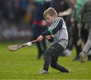 6 February 2022; Limerick supporter Ciarán Hickey, six years, from Castleconnor, practicing his hurling skills during half time of the the Allianz Hurling League Division 1 Group A match between Wexford and Limerick at Chadwicks Wexford Park in Wexford. Photo by Ray McManus/Sportsfile
