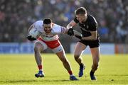 6 February 2022; Padraig Hampsey of Tyrone is tackled by Rian O'Neill of Armagh during the Allianz Football League Division 1 match between Armagh and Tyrone at the Athletic Grounds in Armagh. Photo by Brendan Moran/Sportsfile