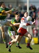 4 April 2004; Colin Holmes, Tyrone, in action against Paul Galvin, left, and Seamus Scanlon, Kerry. Allianz Football League, Division 1A, Round 7, Tyrone v Kerry, Healy Park, Omagh, Co. Tyrone. Picture credit; Brendan Moran / SPORTSFILE *EDI*