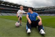 30 July 2013; Dublin footballer Stephen Cluxton with Conal Clancy, age 3, from Ennis, Co. Clare, in attendance at the launch of the Temple Street Children's University Hospital 'Support Your Colours Ball', Croke Park, Dublin. Picture credit: David Maher / SPORTSFILE