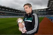 30 July 2013; Kildare manager Kieran McGeeney with 10 month old Oisin Nolan, from Dublin, in attendance at the launch of the Temple Street Children's University Hospital 'Support Your Colours Ball', Croke Park, Dublin. Picture credit: David Maher / SPORTSFILE