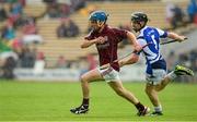 28 July 2013; Darragh Dolan, Galway, in action against Dwane Palmer, Laois. Electric Ireland GAA Hurling All-Ireland Minor Championship, Quarter-Final, Galway v Laois, Semple Stadium, Thurles, Co. Tipperary. Picture credit: Ray McManus / SPORTSFILE