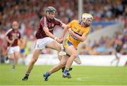 28 July 2013; Conor McGrath, Clare, on his way to scoring his side's first goal despite the efforts of Kevin Hynes, Galway. GAA Hurling All-Ireland Senior Championship, Quarter-Final, Galway v Clare, Semple Stadium, Thurles, Co. Tipperary. Picture credit: Stephen McCarthy / SPORTSFILE