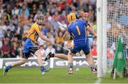 28 July 2013; Jonathan Glynn, Galway, shoots to score his side's first goal past Clare goalkeeper Patrick Kelly and Patrick Donnellan, left. GAA Hurling All-Ireland Senior Championship, Quarter-Final, Galway v Clare, Semple Stadium, Thurles, Co. Tipperary. Picture credit: Stephen McCarthy / SPORTSFILE