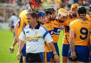28 July 2013; Manager Davy Fitzgerald leave the Clare 'huddle' after speaking to the players before the start of the game. GAA Hurling All-Ireland Senior Championship, Quarter-Final, Galway v Clare, Semple Stadium, Thurles, Co. Tipperary. Picture credit: Ray McManus / SPORTSFILE