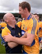 28 July 2013; Clare's Cian Dillon celebrates with a supporter after the game. GAA Hurling All-Ireland Senior Championship, Quarter-Final, Galway v Clare, Semple Stadium, Thurles, Co. Tipperary. Picture credit: Ray McManus / SPORTSFILE