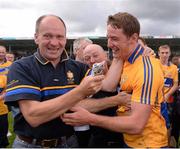 28 July 2013; Clare's Cian Dillon celebrates with supporters after the game. GAA Hurling All-Ireland Senior Championship, Quarter-Final, Galway v Clare, Semple Stadium, Thurles, Co. Tipperary. Picture credit: Ray McManus / SPORTSFILE