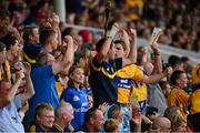28 July 2013; Clare supporters celebrate a score. GAA Hurling All-Ireland Senior Championship, Quarter-Final, Galway v Clare, Semple Stadium, Thurles, Co. Tipperary. Picture credit: Ray McManus / SPORTSFILE