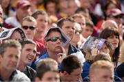 28 July 2013; Supporters use programmes to shiled from the sun. GAA Hurling All-Ireland Senior Championship, Quarter-Final, Galway v Clare, Semple Stadium, Thurles, Co. Tipperary. Picture credit: Stephen McCarthy / SPORTSFILE