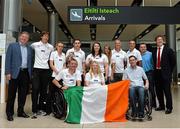28 July 2013; The Irish squad, sponsored by Allianz, return from the 2013 IPC Athletics World Championships in Lyon, France, having secured a total of four gold medals and one silver medal. Pictured are members of the Irish squad with medal winners Jason Smyth, back row, fourth from left, Eglinton, Co. Derry, gold medals in the Men’s 100m – T13 and Men’s 200m – T13, and Orla Barry, back row, centre, Ladysbridge, Co. Cork, silver medal, Women’s Discus Throw – F57/58. Dublin Airport, Dublin. Picture credit: Matt Browne / SPORTSFILE