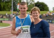 27 July 2013; Marcus Lawlor, St. Laurence O'Toole. Co. Carlow, with his mother Patricia Amond Lawlor after he won silver in the 200m at the Woodie’s DIY National Senior Track and Field Championships. Morton Stadium, Santry, Co. Dublin. Picture credit: Matt Browne / SPORTSFILE