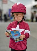 30 July 2013; Four year old Alan Jordan, from Navan, Co. Meath, enjoys a day at the races. Galway Racing Festival, Ballybrit, Co. Galway. Picture credit: Barry Cregg / SPORTSFILE