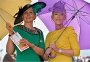 30 July 2013; Sue-Ellen Scahill, from Castlepark, left, and Brid Madden, from Moycullen, both Co. Galway, enjoy a day at the races. Galway Racing Festival, Ballybrit, Co. Galway. Picture credit: Barry Cregg / SPORTSFILE