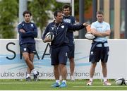 30 July 2013; Racing Metro head coach Laurent Labit issues instructions to his players watched by kicking coach Ronan O'Gara, right, during squad training. Racing Metro Squad Training, Avenue Paul Langevin, Le Plessis Robinson, Paris, France. Picture credit: Fred Porcu / SPORTSFILE