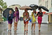 31 July 2013; Racegoers, from left, Gillian Aspil, from Dublin, Cathlin Ryan, Margaret Gildea, Josephine Ryan and Ann Ryan, from Drombane, Co. Tipperay, at the races. Galway Racing Festival, Ballybrit, Co. Galway. Picture credit: Barry Cregg / SPORTSFILE
