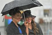 31 July 2013; Racegoers Breda, left, and Mary Clancy, from Oughterard, Co. Galway, at the races. Galway Racing Festival, Ballybrit, Co. Galway. Picture credit: Barry Cregg / SPORTSFILE