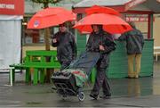 31 July 2013; A general view of bookmakers making their way through the rain to set up their stalls before the day's races. Galway Racing Festival, Ballybrit, Co. Galway. Picture credit: Barry Cregg / SPORTSFILE