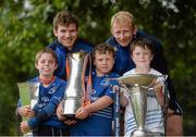 31 July 2013; Leinster players Gordon D'Arcy, left, and Leo Cullen, with camp participants, from left, Shane van Suydan, age 8, from Ballina, Co. Mayo, Ben Merry, from Pearse St., and Jamie O'Connell, age 8, from Foxrock, during a Leinster Rugby Summer Camp at Donnybrook, Dublin. Picture credit: Brian Lawless / SPORTSFILE