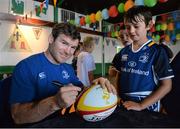 31 July 2013; Leinster's Gordon D'Arcy signs an autograph for Harry Kennedy, age 9, from Sandymount, Co. Dublin, during a Leinster Rugby Summer Camp at Donnybrook, Dublin. Picture credit: Brian Lawless / SPORTSFILE