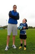 31 July 2013; Leinster's Devin Toner with Senan Branaugh, age 10, from the Curragh Camp, during a Leinster Rugby Summer Camp at Cill Dara RFC, Kildare, Co. Kildare. Picture credit: David Maher / SPORTSFILE