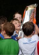 31 July 2013; Camp participant and Leinster supporter Matt Simons, from Dublin, gets to grips with the Celtic League trophy, during a Leinster Rugby Summer Camp at Donnybrook, Dublin. Picture credit: Brian Lawless / SPORTSFILE