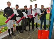 31 July 2013; Jockeys, from left, Mark Walsh, Davy Condon, Shane Foley, David Casey, Robbie Power and Jane Mangan join together in a test of strength in aid of the Jockeys Emergency Fund. Galway Racing Festival, Ballybrit, Co. Galway. Picture credit: Barry Cregg / SPORTSFILE
