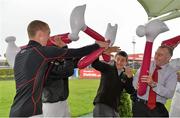 31 July 2013; Jockeys, from left, Mark Walsh, Davy Condon, Shane Foley, and David Casey attack each other with inflatable hammers as they join together in a test of strength in aid of the Jockeys Emergency Fund. Galway Racing Festival, Ballybrit, Co. Galway. Picture credit: Barry Cregg / SPORTSFILE