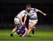 5 February 2022; Alan Flynn of Tipperary is tackled by John Lennon, 11, and Fiachra Fennell of Laois during the Allianz Hurling League Division 1 Group B match between Laois and Tipperary at MW Hire O'Moore Park in Portlaoise, Laois. Photo by Ray McManus/Sportsfile