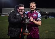 11 February 2022; Drogheda United captain Dane Massey is presented the Jim Malone Cup by Killian Moran after the the Jim Malone Cup match between Dundalk and Drogheda United at Oriel Park in Dundalk, Louth. Photo by Ben McShane/Sportsfile