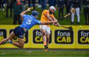 12 February 2022; Neil McManus of Antrim scores his side's first goal despite the attention of Eoghan O'Donnell of Dublin during the Allianz Hurling League Division 1 Group B match between Antrim and Dublin at Corrigan Park in Belfast. Photo by Ben McShane/Sportsfile